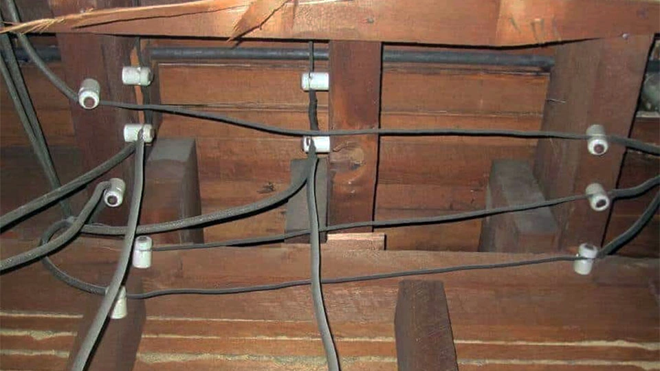 Knob-and-tube electrical wiring installed in the attic of an older Ontario home